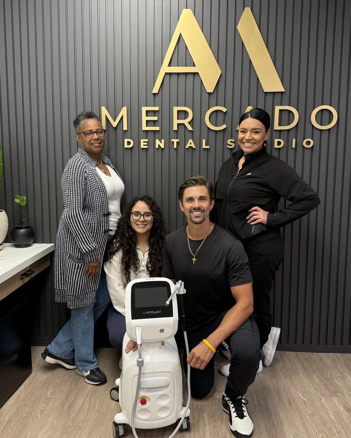 Dr. Alex Mercado and the Mercado Dental Studio team with the practice's LiteTouch Er:YAG dental laser in East Sacramento